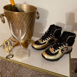 Black and gold leather and tweed hi-top Chanel sneakers in mint condition.